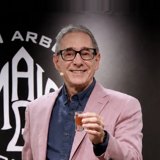 Michael Reuter performing on stage at the Ann Arbor Magic Club